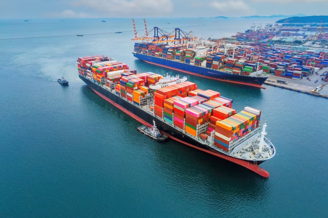 Cargo ship moving through a canal