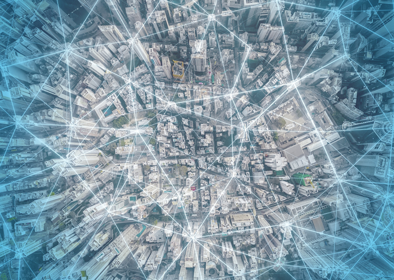 City overview with digital lines pin pointing locations.