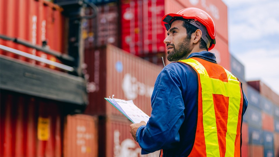 Man inspecting shipping containers
