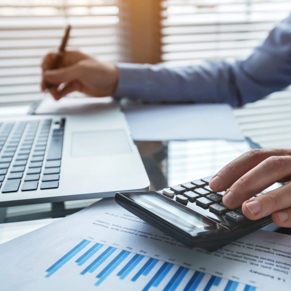 Shipper at their desk working on reconciliation tasks